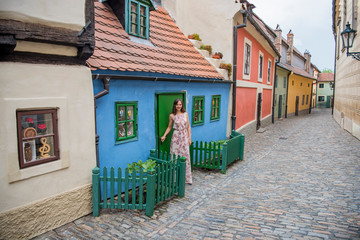 Cobblestone street and colorful 16th century cottages of artisans known as Golden Lane inside the castle walls Prague Czech Republic