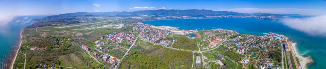 Panorama of the resort city of Gelendzhik. The kind with the Thin Cape. Gelendzhik Bay is visible in the background of Markotkh ridge. On the right the entrance to the Gelendzhik Bay and the lighthous