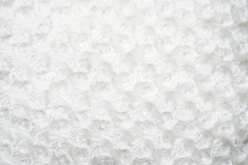 abstract white background of fleecy fabric with circles