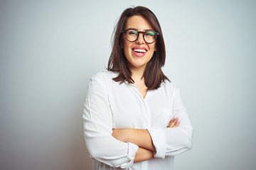 Young beautiful business woman wearing glasses over isolated background happy face smiling with...