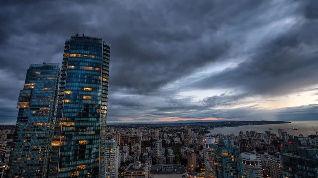 Cinemagraph of an Aerial view of Downtown City during a stormy summer sunset. Taken in Vancouver, British Columbia, Canada. Still Image Continuous Animation