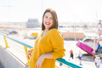 Beautiful young woman smiling cheerful walking on the street on a sunny day, casual pretty girl at the town