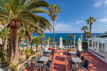 Bar terrace by the mediterranean sea in Lloret de Mar, Costa Brava, Catalonia, Spain.