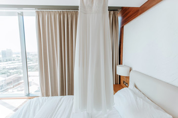 Wedding white dress in a light interior