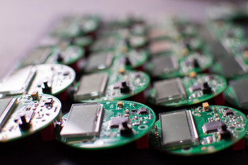 round electronic boards with display, microchip and processor, many meter components