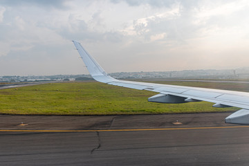 Large commercial airplane taking off or landing at Guarulhos airport, Brazil.