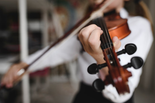Close-up of girl playing violin