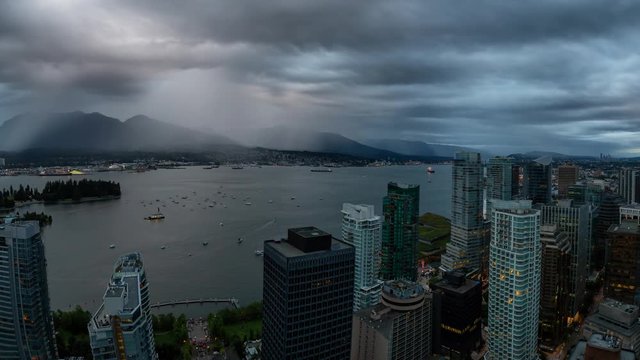 Cinemagraph of an Aerial view of Downtown City during a stormy summer sunset. Taken in Vancouver, British Columbia, Canada. Still Image Continuous Animation