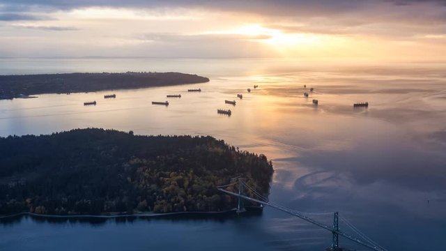 Aerial view of Lions Gate Bridge and Stanley Park during a stormy cloud covered sky before sunset. Taken in North Vancouver, British Columbia, Canada. Still Image Continuous Animation - Cinemagraph