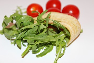 fresh salad with tomatoes and arugula, banana chips with arugula and  tomatoes, food