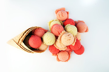 Set of ice cream scoops of different colors and flavours in the summer