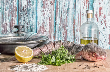 Still life with fish of red-finned mullet for cooking, vintage