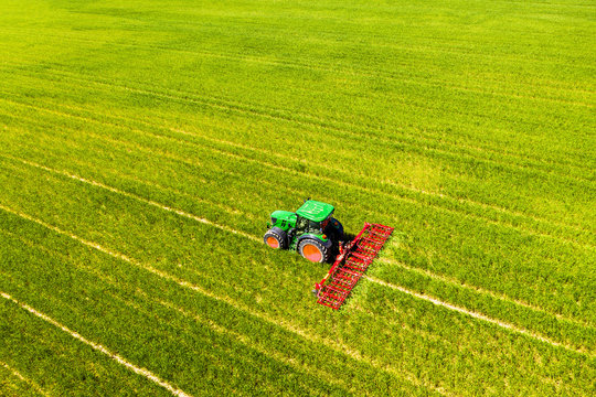 Aerial view of tractor on field, soil loosening, Hochtaunuskreis, Hesse, Germany