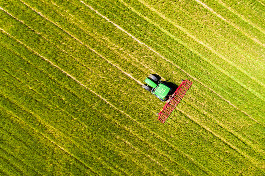 Aerial view of tractor on field, soil loosening, Hochtaunuskreis, Hesse, Germany