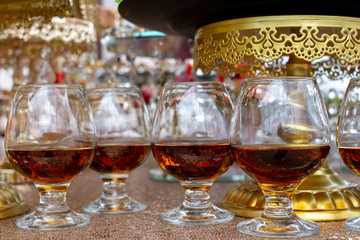 Alcoholic drinks in glasses, cognac and brandy. Party and holiday celebration. Asting and degustation concept.