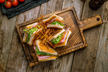 club sandwich with ham on the board
