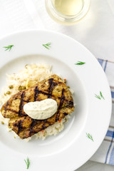 Grilled mahi mahi fish in portrait orientation. This lean tropical white fish is also known as common dolphinfish or dorado. Considered an healthy food rich in protein, it is perfect for bbq grilling.
