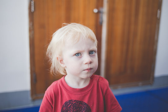 Portrait of a sad and stubborn little girl