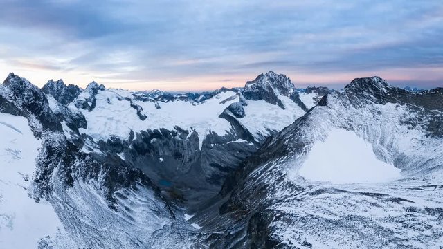 Aerial panoramic view of the beautiful American Mountain Landscape during a cloudy and colorful sunrise. Taken in the remote area Northeast of Seattle, Washington, United States. Image Animation