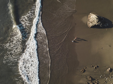 Family at the beach, Aerial view, Maluk, Sumbawa, Indonesia