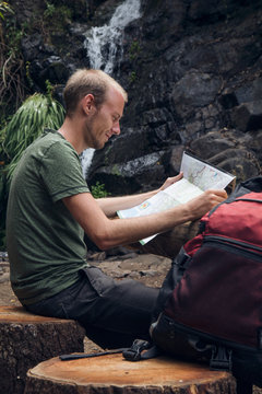 Hiker taking a break at rest area, Barranco el Cedro, La Gomera, Canary Islands, Spain