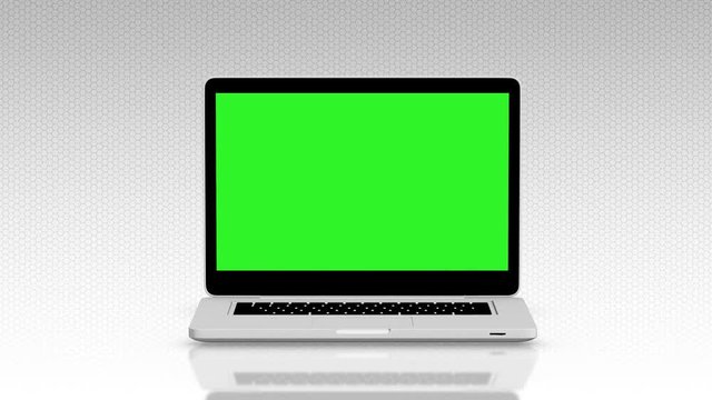 Modern laptop appearing from the side white background and green screen