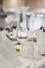 Wine glasses and glasses on the server table.Luxurious elegant dinner at the table in the restaurant. Holiday table decoration
