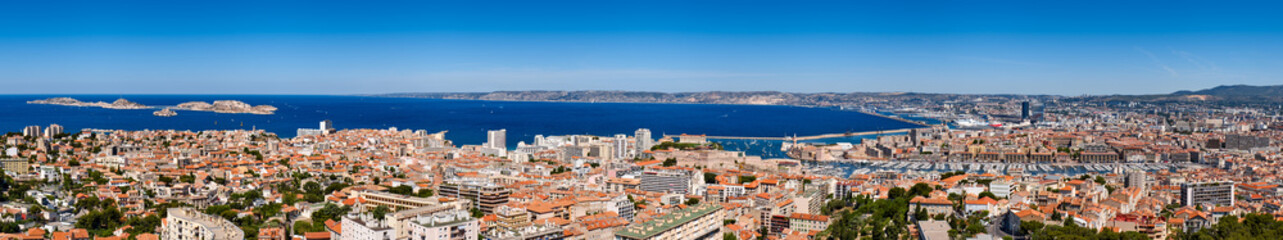 Fototapeta na wymiar France, Bouches-du-Rhône (13), Marseille harbor. Panoramic summer view on Marseille rooftops with Vieux Port and the Mediteranean Sea. Europe
