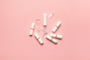 Tampons on a soft pink background. Modern female intimate gynecological hygiene. Eco zero waste concept. Copy spase place for text. Flat lay