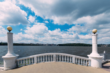 beautiful observation deck. white fence with columns on the shor