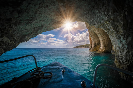 Tourist boat sailing inside the Blue Caves