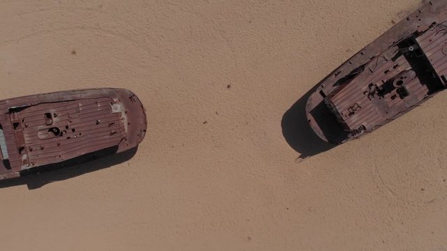 Real model of former sea boat on a pedestal as monument of passed days when Mo'ynoq was an active sea port on Aral sea. Picture taken in former piscatorial port Mo'ynoq Moynaq or Muynak, Uzbekistan.