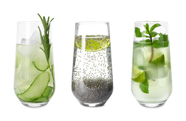 Set of glasses with different refreshing drinks on white background