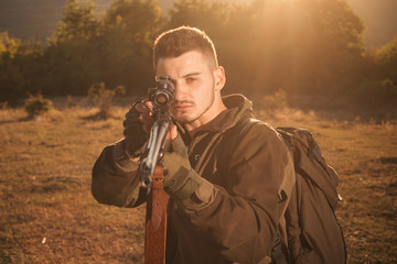 Hunter Classic. Hunter with shotgun gun on hunt. Closed and open hunting season. Illegal Hunting...