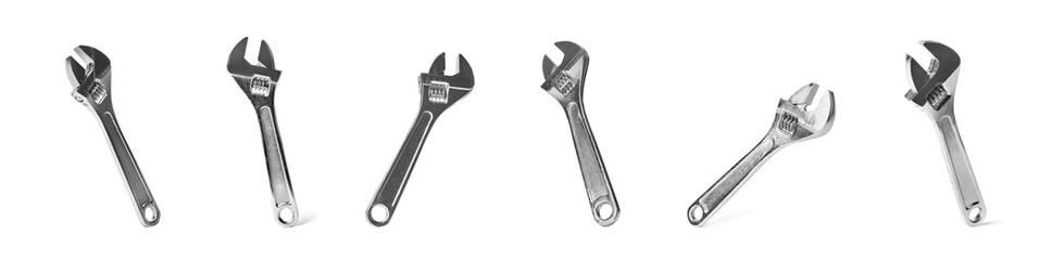 Set of adjustable wrenches on white background. Construction tools