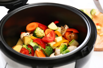 Closeup view of multi cooker with vegetables