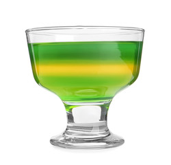Tasty layered jelly dessert in glass on white background