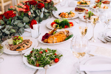 tables setting at a luxury wedding hall. table for guests. dishe