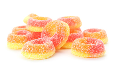 Pile of delicious jelly candies on white background