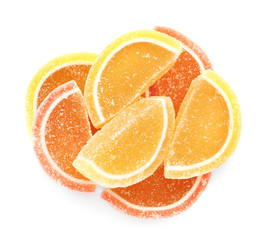 Pile of delicious jelly candies on white background, top view