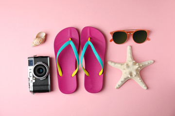Flat lay composition with different beach objects on color background