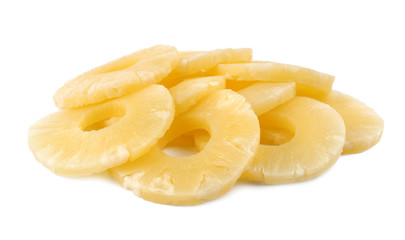 Slices of delicious sweet canned pineapple on white background