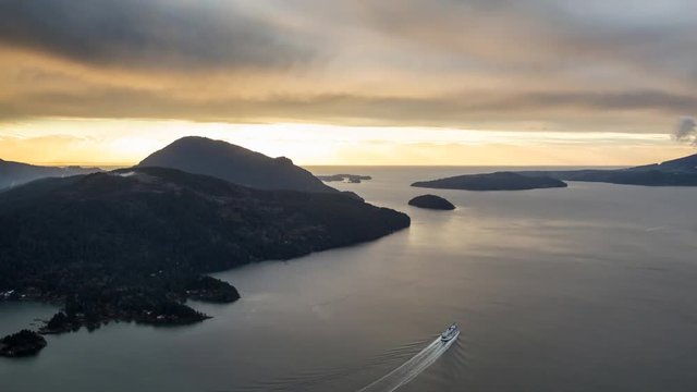 Aerial landscape view of Sunshine Coast during a vibrant and dramatic sunset. Taken Northwest of Vancouver, British Columbia, Canada. Still Image Continuous Animation