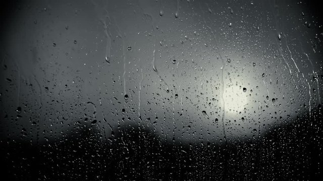 Depressing weather through window in black and white