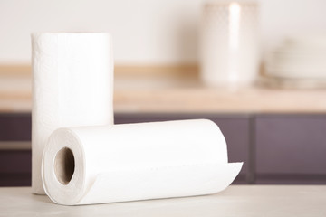 Rolls of paper towels on table in kitchen