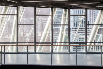 Abstract contemporary architecture or modern interior photograph. Geometric shapes and patterns formed by windows and railing on contemporary hallway.