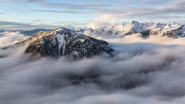 Aerial view of a beautiful Canadian Mountain Landscape during a winter sunset. Taken north of Vancouver, British Columbia, Canada. Still Image Continuous Animation