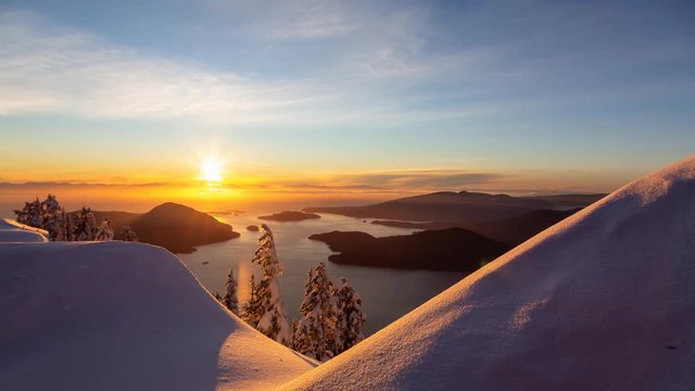 Beautiful Canadian Landscape view during a colorful winter sunset. Taken from top of Mnt Harvey, North of Vancouver, BC, Canada. Still Image Continuous Animation