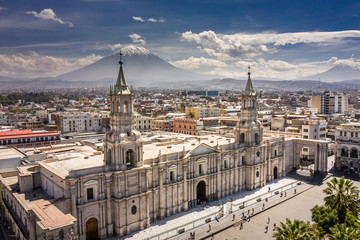 Aerial drone view of Arequipa main square and cathedral church, with the Misti volcano as background. - obrazy, fototapety, plakaty
