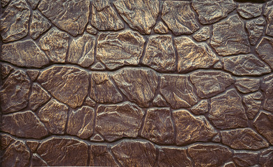 Abstract background imitation of an iron wall of stone.